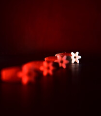 white plastic object with red light effects