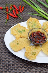 Traditional indonesian food. Tempe Mendoan. Indonesian Street Food, Tempe goreng tepung or fried flour tempe. Served with chilli sweet soy sauce