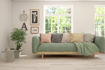 White living room with sofa and summer landscape in window. Scandinavian interior design. 3D illustration