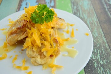 Pisang Goreng or fried banana with grated cheese and condensed milk