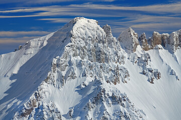 Winter landscape of the snow flocked San Juan Mountains with beautiful clouds above, Colorado, USA