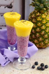 Smoothie made from Blueberry, Pineapple, Coconut Water, Soy yogurt and Agave Syrup. Sprinkle with chia seeds