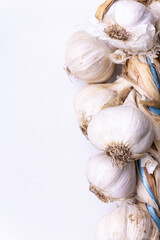 A bunch of garlic closeup on a light background