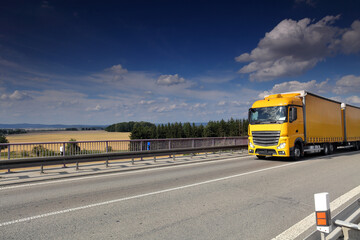 Landscape with a moving truck on the highway. 