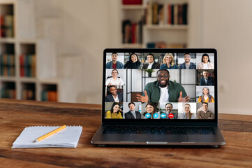Online video communication. View at laptop screen with confident african american businessman or...