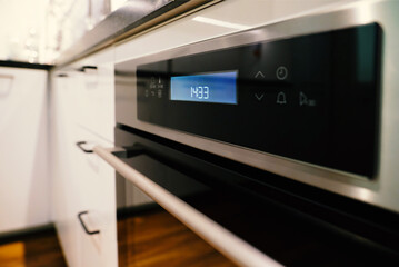 Background, blur, out of focus, bokeh. Electric oven built-in kitchen furniture.