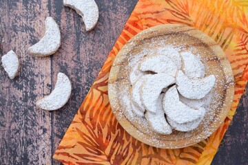 Putri Salju or crescent-shaped cookies coated with powdered sugar. Traditional Indonesian cookies...