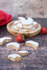 Putri Salju or crescent-shaped cookies coated with powdered sugar. Traditional Indonesian cookies to celebrate Eid al Fitr