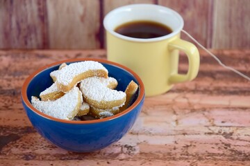 Putri Salju or crescent-shaped cookies coated with powdered sugar. Traditional Indonesian cookies to celebrate Eid al Fitr