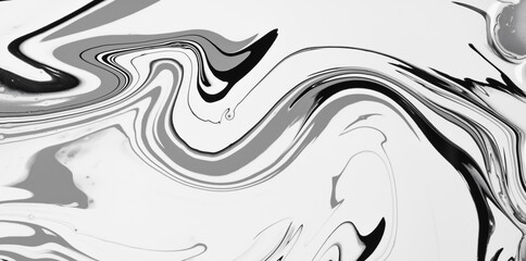 Flow of black and white foil marble texture on canvas. Abstract background of acrylic fluid art.