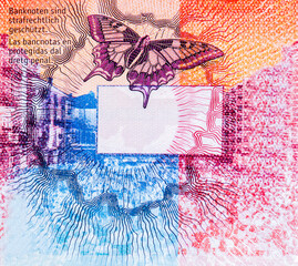 a kaleidoscope in which colourful patterns are produced through reflected light. Portrait from...