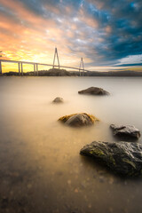 The modern bridge at uddevalla in the sunset. Long exposure of the Uddevallabron Bridge in Sweden. fjord, highway traffic