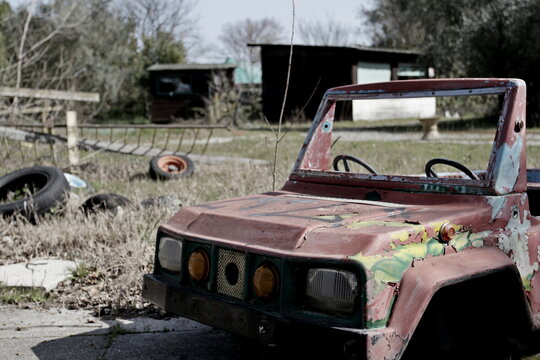 Children's Car In An Abandoned Playground. Post Apocalyptic Ambition. 