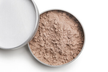 A jar of organic non-toxic chemicals free dry shampoo. DIY project for healthy low toxic living. Simple shampoo powder containing just natural ingredients, cocoa powder, cornstarch and essential oil.