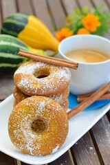 Pumpkin donuts with a cup of coffee