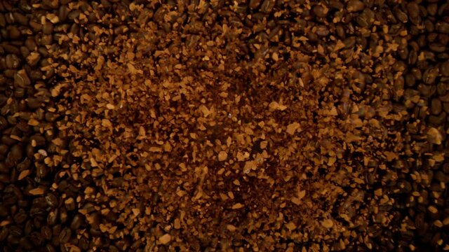 Super slow motion of flying instant coffee, coffee beans on background. Filmed on high speed cinema camera, 1000 fps.