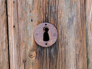 Old lock on wooden door