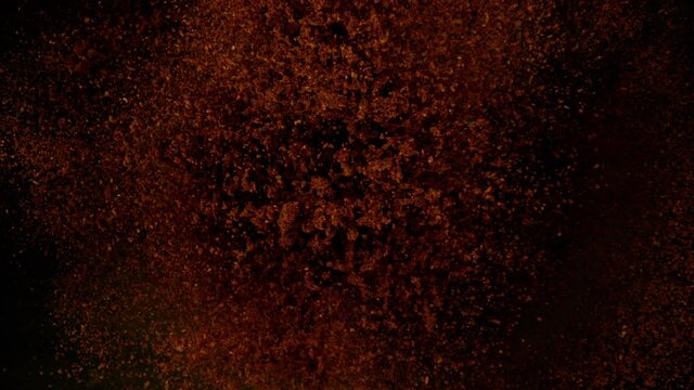 Super slow motion of flying ground coffee. Filmed on high speed cinema camera, 1000 fps.