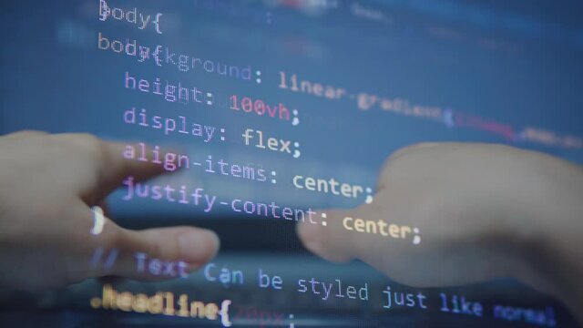 HTML coding at the laptop. Concept of Hacking programming. Typing the code on the laptop Keyboard 