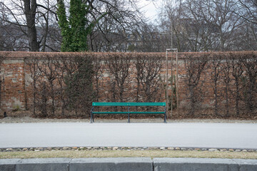 empty green bench in a park