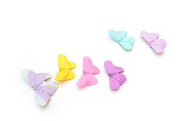 Colorful butterfly origami flocking on white