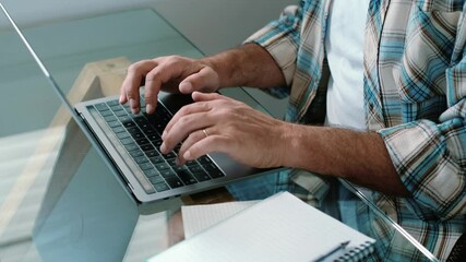 Close up of caucasian hands man working and typing on laptop computer keyboard - office and smart working job concept for professional business man or employee corporate company - Powered by Adobe