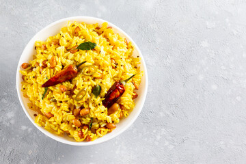 Yellow Rice, Turmeric Rice wih Lemon, Ginger and Fenugreek in a bowl, Indian Food. Top view with copy space.
