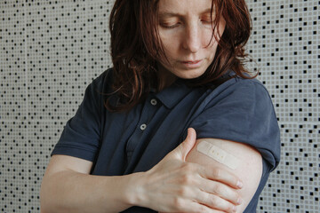 Vaccinated Woman Showing Arm After Vaccine Injection