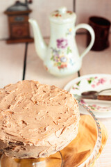 Delicious round cake with white caramel and coffee buttercream