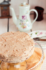 Delicious round cake with white caramel and coffee buttercream