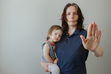 mother and daughter, a child after vaccination. The woman makes a stop gesture. Stop viruses concept