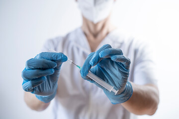 Fototapeta premium nurse preparing syringe for vaccination