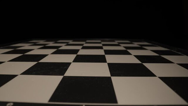 Empty chessboard in close-up - sliding shot - macro view