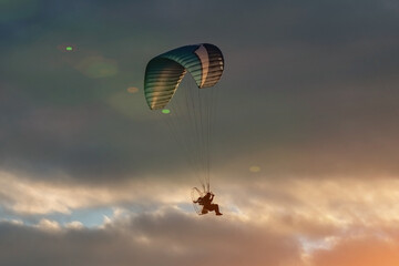 paraglide with a motor high in the sky