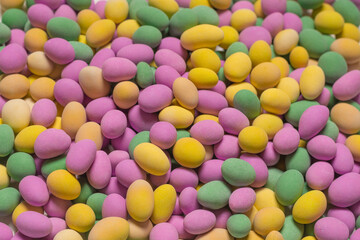Group of colorful peanuts in glaze.