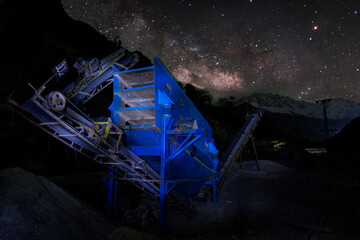 Plant of industrial stone crusher with night sky in background