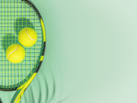 Tennis. Spring sport composition with yellow tennis ball and racket on a green background of tennis court with copy space. Sport and healthy lifestyle. The concept of outdoor game sports. Flat lay