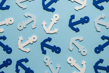 Blue anchors on a blue background.
