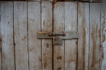 Door of old rustic wood with padlock vintage concept