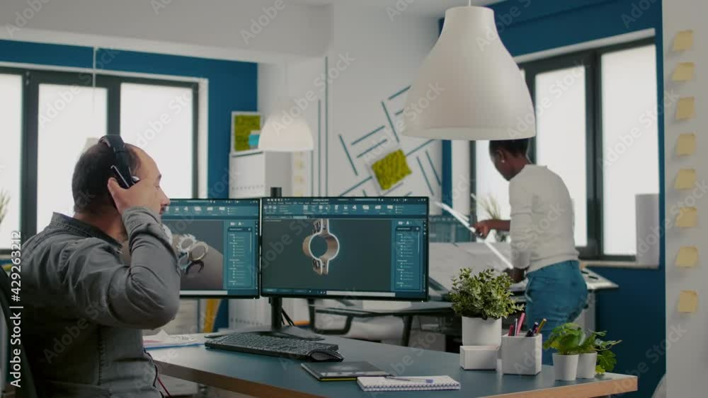 Poster mecanic technician working on cad software using computer with two monitors innovating an efficient 