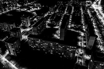 View from above of the roofs of contemporary block of flats. Ulyanovsk residential district at nigh. Black and white