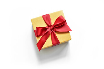 box with a red ribbon on a white background with a shadow.  presentation of the gift.  present in beige packaging