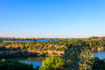 View of beautiful flooded granite quarry near the Dnieper river in Chykalovka village near Kremenchug, Ukraine