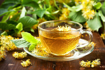 Linden tea in  transparent glass and linden flowers