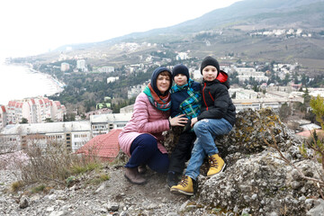 Mother with sons on background of Gurzuf on Mount Bolgatura