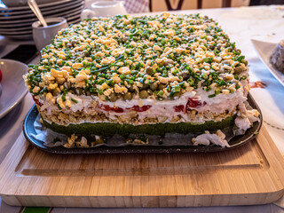 Spring vegetable salad with eggs, peas, and chives on the wooden board. Good for party food.
