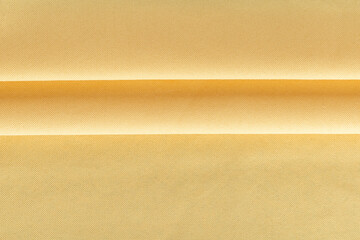 Obraz premium thick curtain cotton fabric of yellow color, folded in folds, background