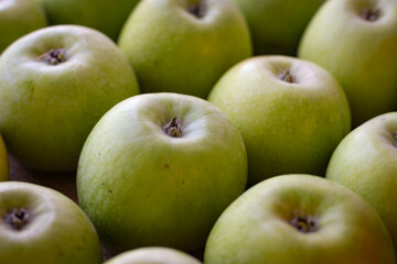 Apples stand on a wooden surface