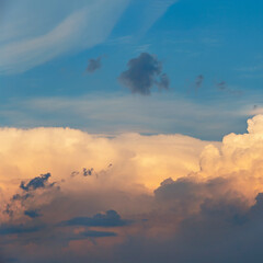 evening sky with beautiful sunlit clouds as a natural background