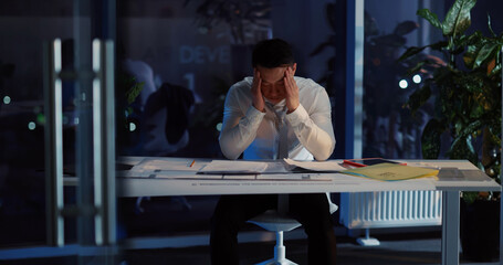 Japanese handsome sad adult businessman losing job having financial problems thinking over life...